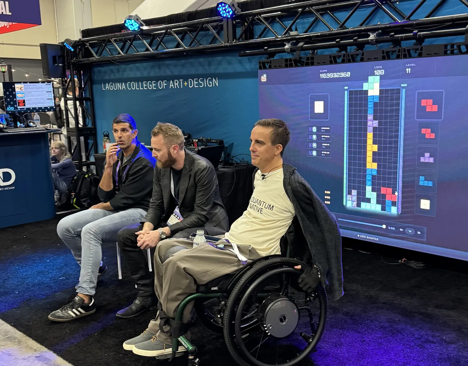 Players watching Quantris on the big screen at the Laguna College of Art and Design booth, GDC 2026